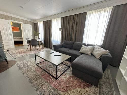 a living room with a couch and a table at Stintebakken 1 in Arendal