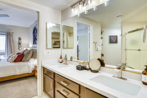 a bathroom with two sinks and a large mirror at Family-Friendly Condo with Pool Access in Phoenix! in Phoenix