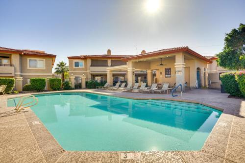 a swimming pool in front of a house at Family-Friendly Condo with Pool Access in Phoenix! in Phoenix