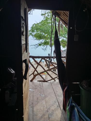a view of the ocean from the inside of a room at Atalaya Buceo Cari Blue in Playa Blanca