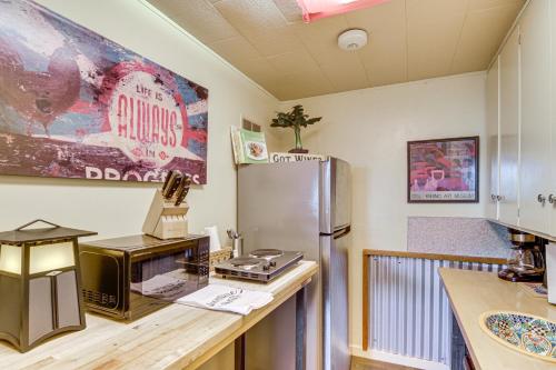 a kitchen with a microwave and a refrigerator at Walk to Dtwn Livingston Studio with Mtn Views! in Livingston