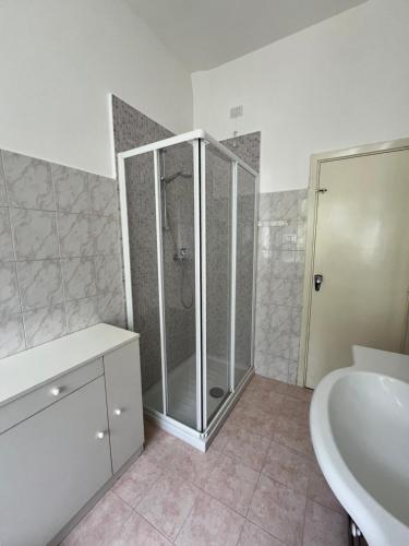 a bathroom with a shower and a sink at Casa Frasassi in Falcioni