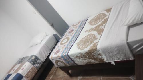 Postel nebo postele na pokoji v ubytování Jimena Hostal
