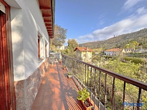 a balcony of a house with a view at Cuetu el Tornu in Puertas