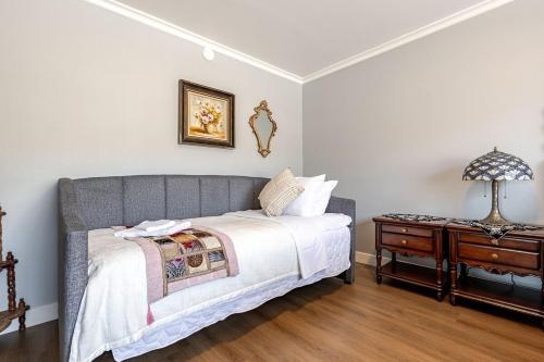 a bedroom with a bed and a nightstand at Los Angeles - Centrally located between Disneyland Universal Studios Beverly Hills and Downtown LA Most ideal city to stay with stunning views and heated pool in Hacienda Heights