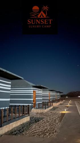 a building with a sign that reads sunset luxury camp at Sun Set Luxury Camp in Disah