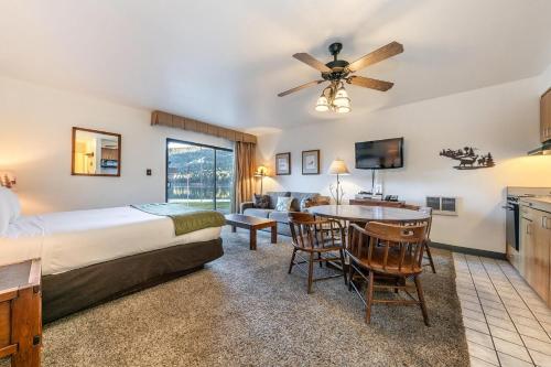 a hotel room with a bed and a table and chairs at 144 Bldg C condo in Truckee