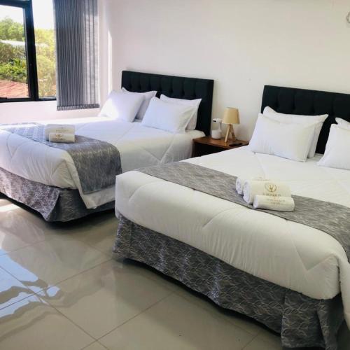 Cama o camas de una habitación en Hotel Luis Pablo