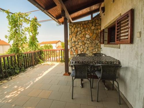 Apartment Kostanjevac with Terrace and Sea View