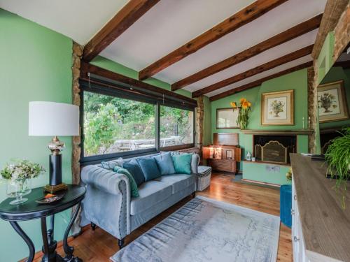 a living room with a couch and a table at Villa in Pescia with Tuscan Wine Views in Pescia
