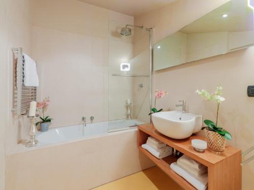 a bathroom with a sink and a bath tub at 10 Bedrooms Villa in Lucca with pool in Montecarlo