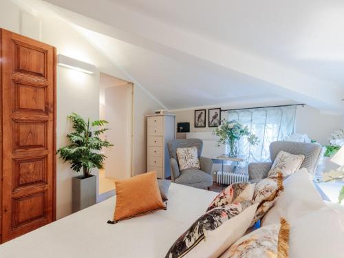 a living room with a white couch and a table at 10 Bedrooms Villa in Lucca with pool in Montecarlo