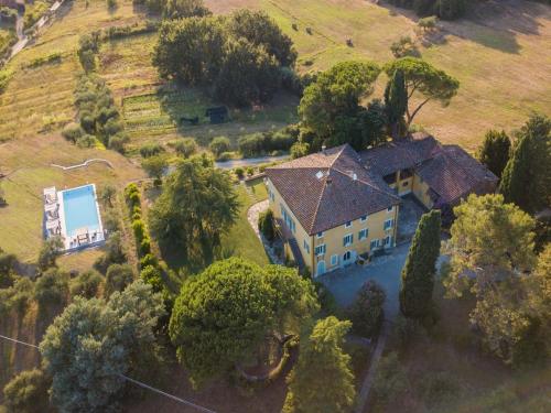 an aerial view of a house on a hill at 10 Bedrooms Villa in Lucca with pool in Montecarlo