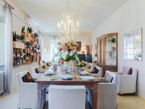 a dining room with a table and chairs at 10 Bedrooms Villa in Lucca with pool in Montecarlo