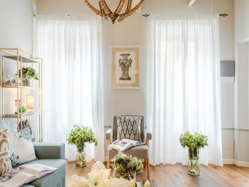 a living room with a couch and a chair at Apartment in Montecarlo near Wine Region in Montecarlo