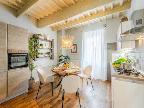 a kitchen and dining room with a table and chairs at Apartment in Montecarlo near Wine Region in Montecarlo