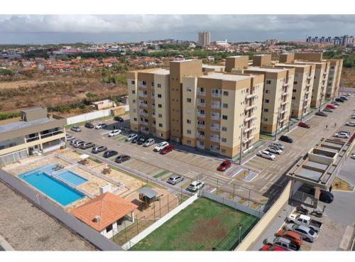 an aerial view of a parking lot with buildings at Belíssimo Apto a 2 km da Litorânea in São Luís