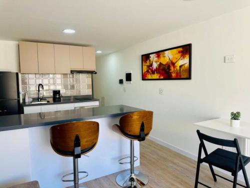 Η κουζίνα ή μικρή κουζίνα στο Unicentro Apartamentos, WiFi y Parking Gratis