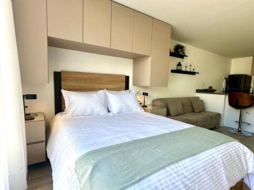 Ένα ή περισσότερα κρεβάτια σε δωμάτιο στο Unicentro Apartamentos, WiFi y Parking Gratis