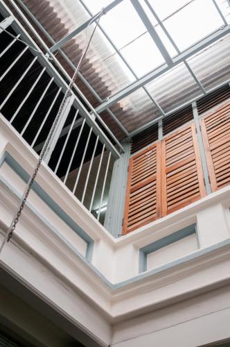 a ceiling with wooden windows in a building at Ah Tong Residence - 3 mins to Kimberley Night Market in George Town
