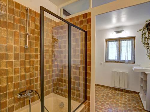 a bathroom with a shower and a sink at Gîte de charme avec terrasse, animaux acceptés, confort moderne - FR-1-496-305 in Belmont-de-la-Loire