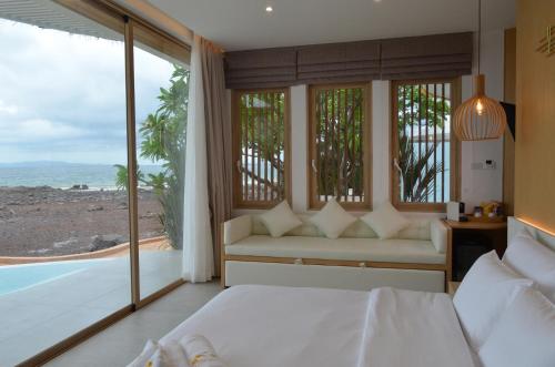 Ένα ή περισσότερα κρεβάτια σε δωμάτιο στο Madusea Grand Villa มาดูซี แกรนด์ วิลล่า