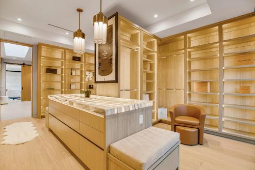 a dressing room with wooden cabinets and a counter top at Hutton Villa in Los Angeles