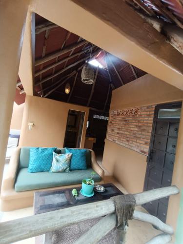 a living room with a couch and a table at Botanical Studios Sayulita in Sayulita