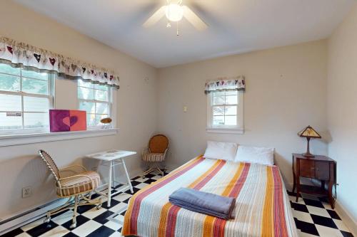a bedroom with a bed and a checkered floor at Town of Lewes --- 107 E 4th St in Lewes