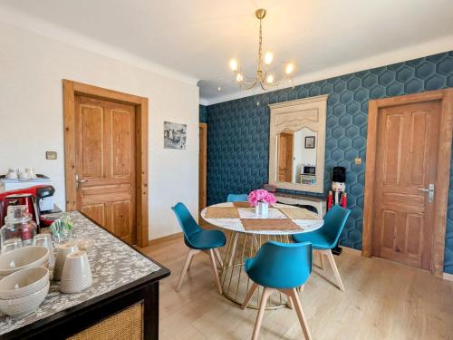 a kitchen and dining room with a table and chairs at Deux chambres avec entrée indépendante, accès à un jardin - FR-1-589-817 in Fraize