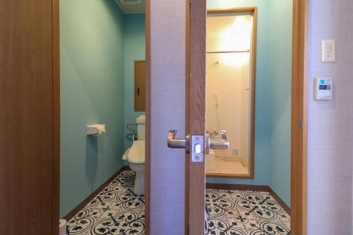 Koupelna v ubytování Hotel NALU　ホテルナル