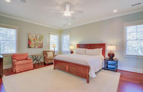 a bedroom with a bed and a chair at 913 Carolina Boulevard by AvantStay Private Pool Ocean View Rooftop in Mount Pleasant