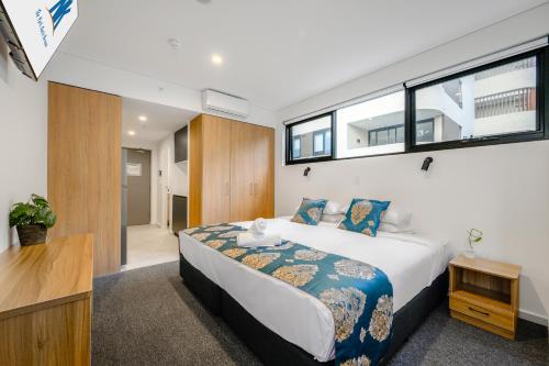 Cama o camas de una habitación en The Park OASIS Burwood