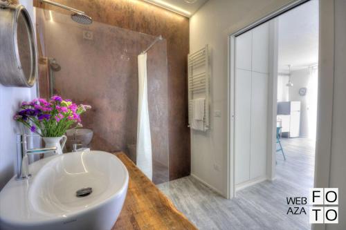 a bathroom with a white sink and a mirror at G.H. Polignano a Mare in Polignano a Mare
