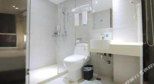 a bathroom with a toilet and a sink and a shower at City Comfort Inn Changsha Window of the World Zhongmao City in Changsha
