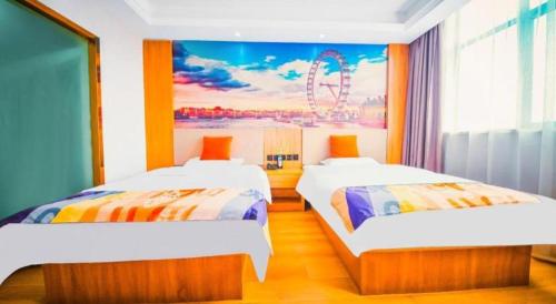 two beds in a room with a painting on the wall at Shell Hotel Wuhu Jiujiang District Daqiao Town Huashan Road in Wuhu