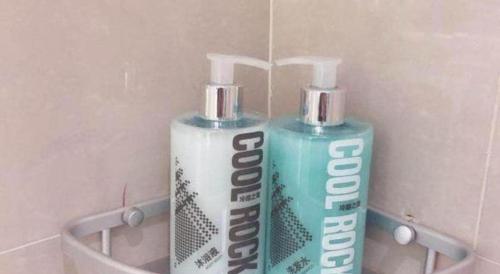 two bottles ofodorizers are sitting on a wall at City Comfort Inn Lhasa Potala Palace Scenic View in Lhasa