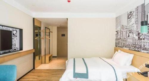 a hotel room with a bed and a tv at City Comfort Inn Lhasa Potala Palace Scenic View in Lhasa