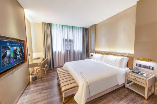 Katil atau katil-katil dalam bilik di Tomeet Hotel
