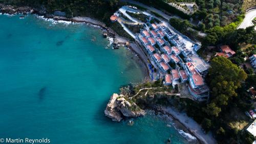 an aerial view of a beach with a group of houses at Blue Bay in Cefalù