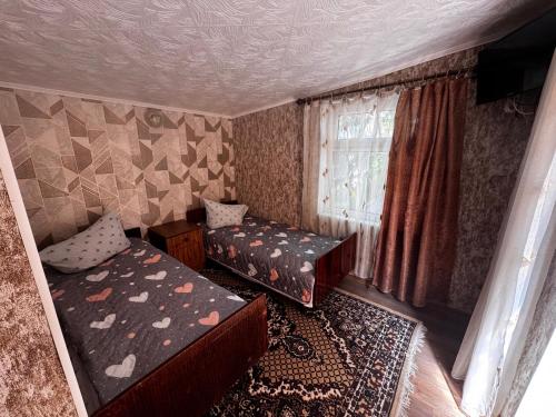 Postel nebo postele na pokoji v ubytování Helena guest house