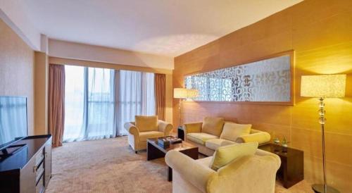 Χώρος καθιστικού στο Huangshan Xuanyuan International Hotel