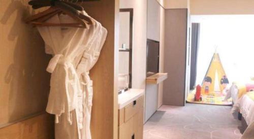 Ένα ή περισσότερα κρεβάτια σε δωμάτιο στο ZHONG DING HOTEL