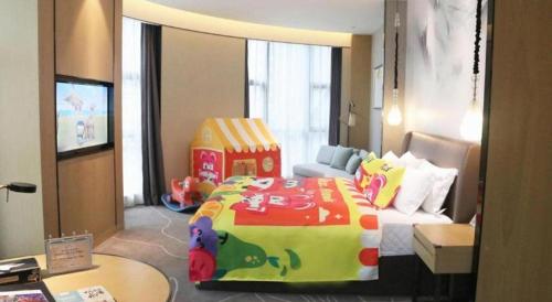 Ένα ή περισσότερα κρεβάτια σε δωμάτιο στο ZHONG DING HOTEL