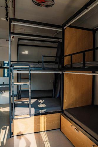 a room with four bunk beds in it at Quiri Hostel in Hanoi