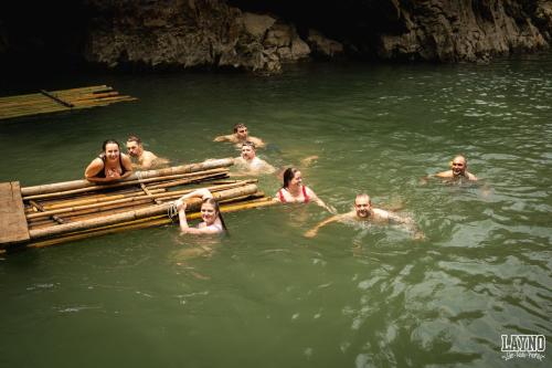 a group of people in the water near a raft at Quiri Hostel in Hanoi