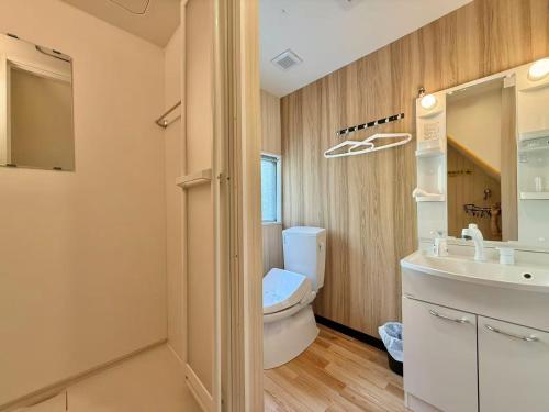 a bathroom with a toilet and a sink at TOKYO SKYTREE VILLIA-Whole villia space perfect for families and groups in Tokyo