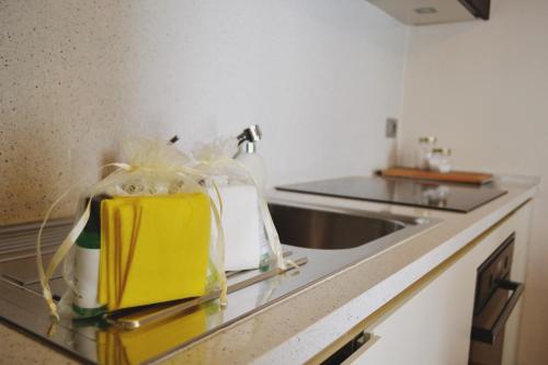 a kitchen counter with bags on a counter top at Maison Carrel Elegant 7 in Breuil-Cervinia