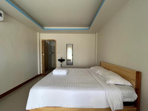 Katil atau katil-katil dalam bilik di FOUR-G Home Stay & Komodo Tour