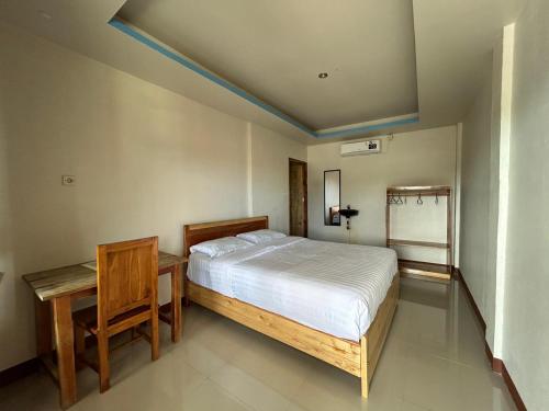 Katil atau katil-katil dalam bilik di FOUR-G Home Stay & Komodo Tour
